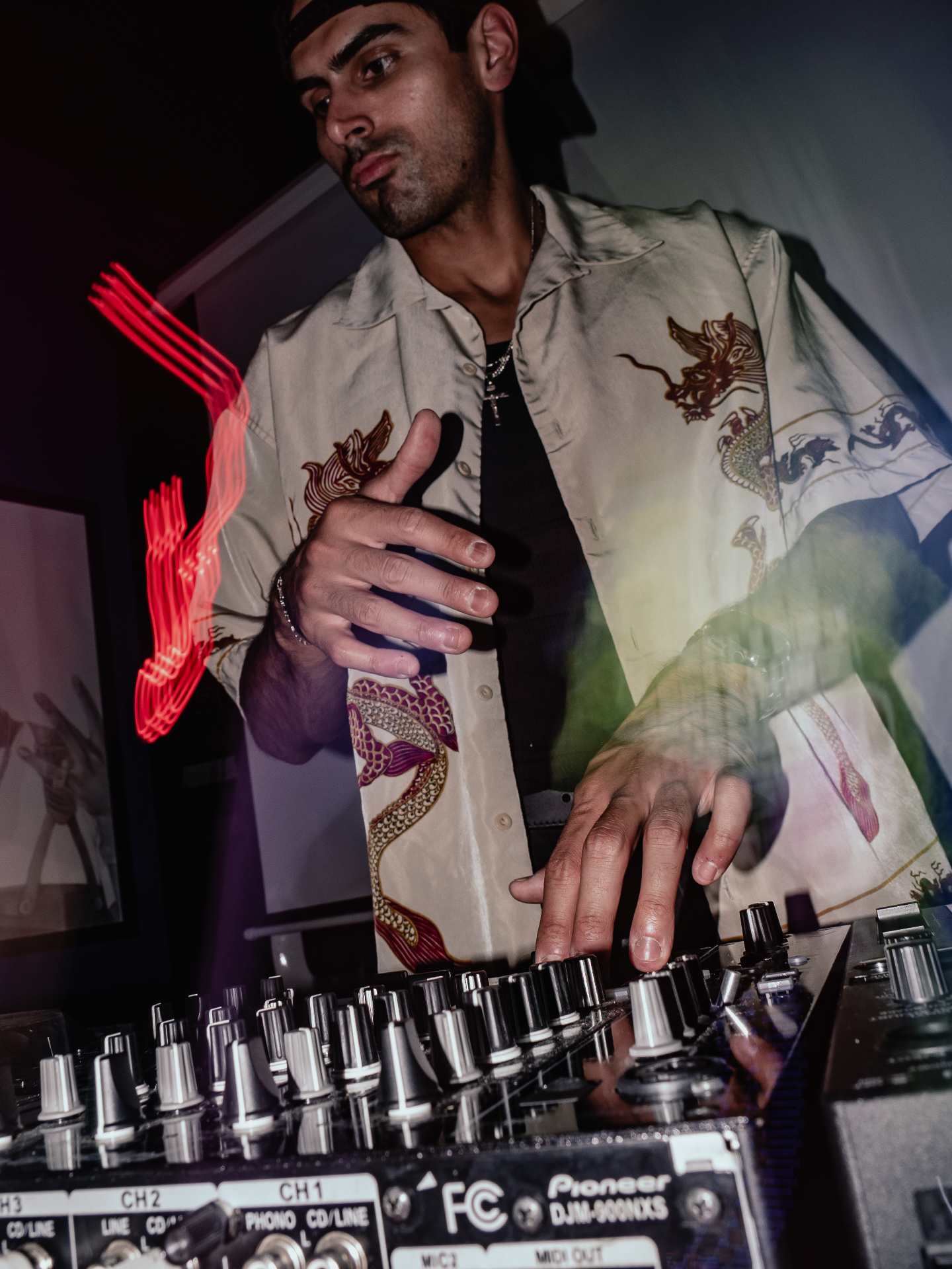 B¡NO mixing on a Pioneer DJM-900NXS with red light trails